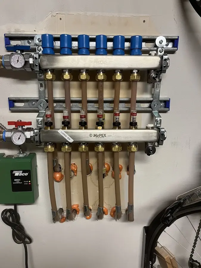 Plumber performing Water Heater Repair at a residential property in Belfair