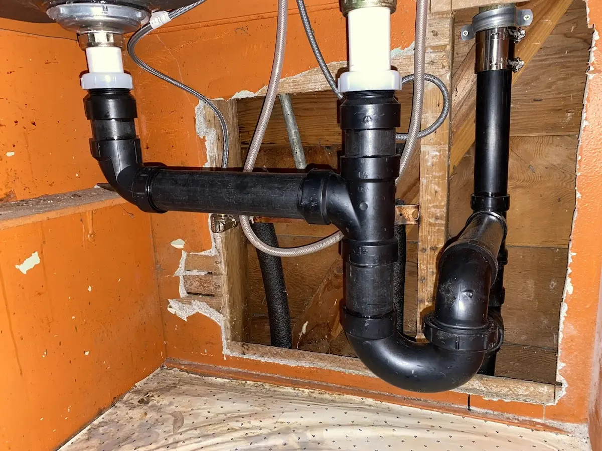Professional Garbage Disposal Repair equipment and tools on the job in Belfair